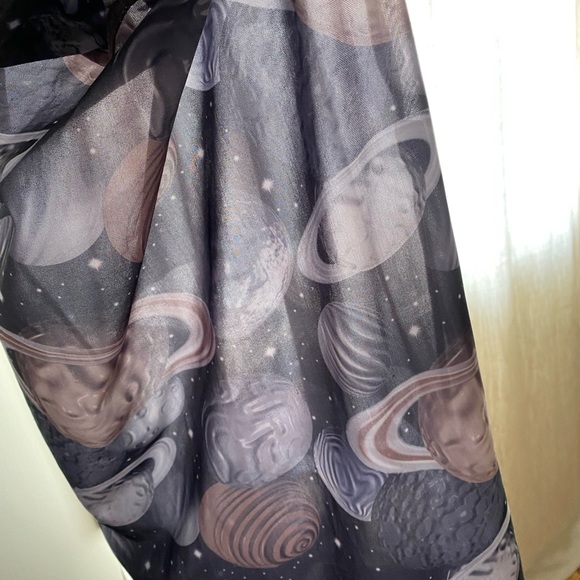 Light see through pencil stretchy skirt with planets on it. - Picture 2 of 3